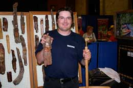 man holding carving